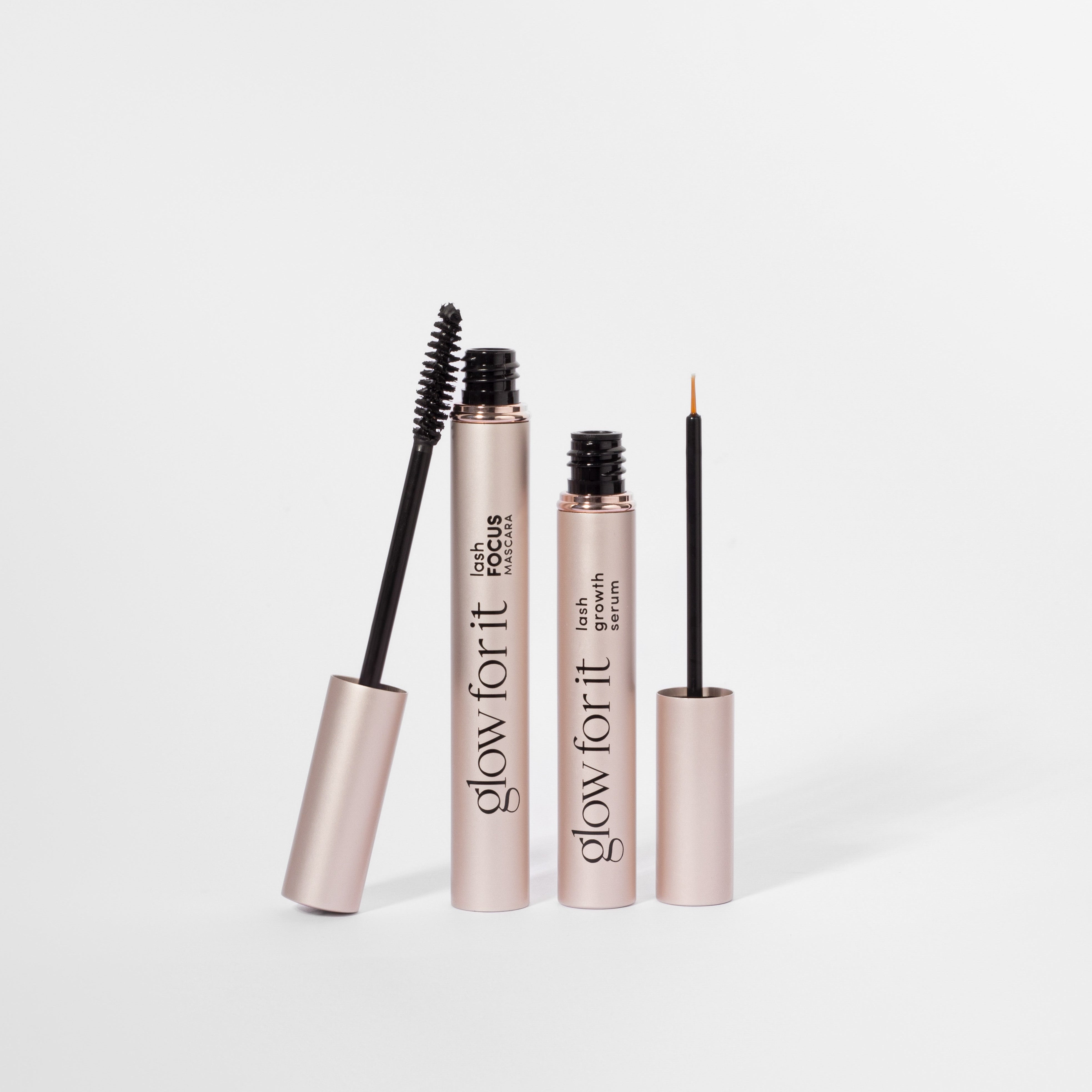 Mascara and lash serum on a white background