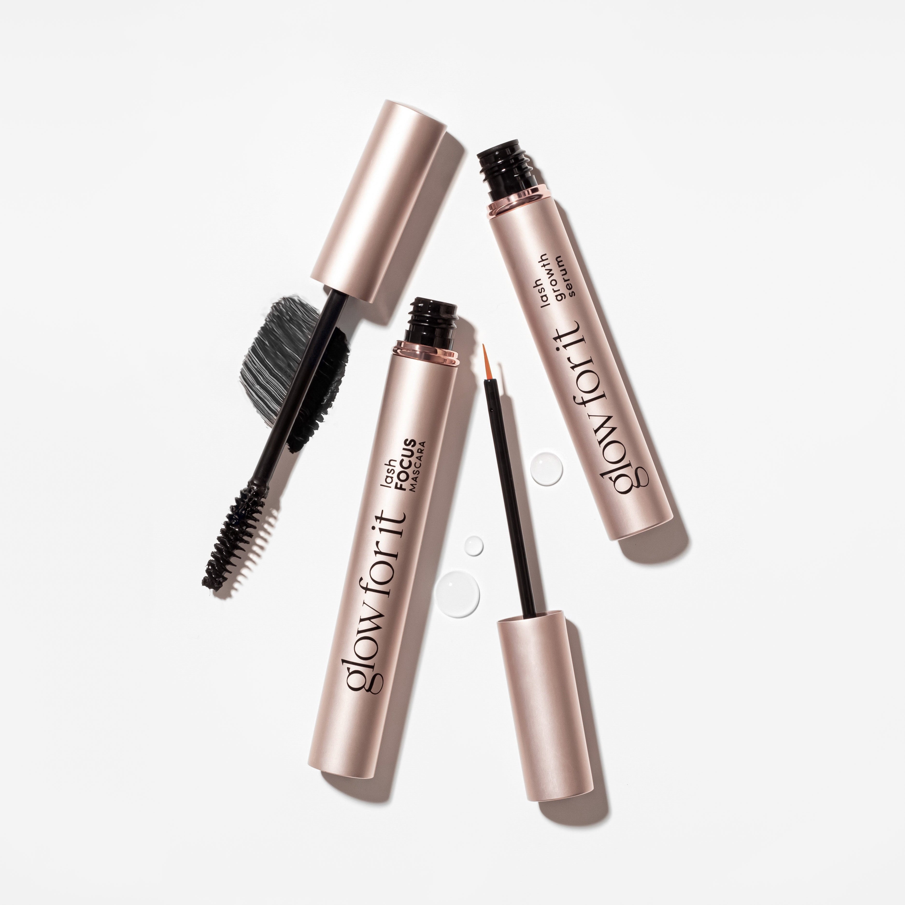 Mascara and lash serum on white background with swatches.