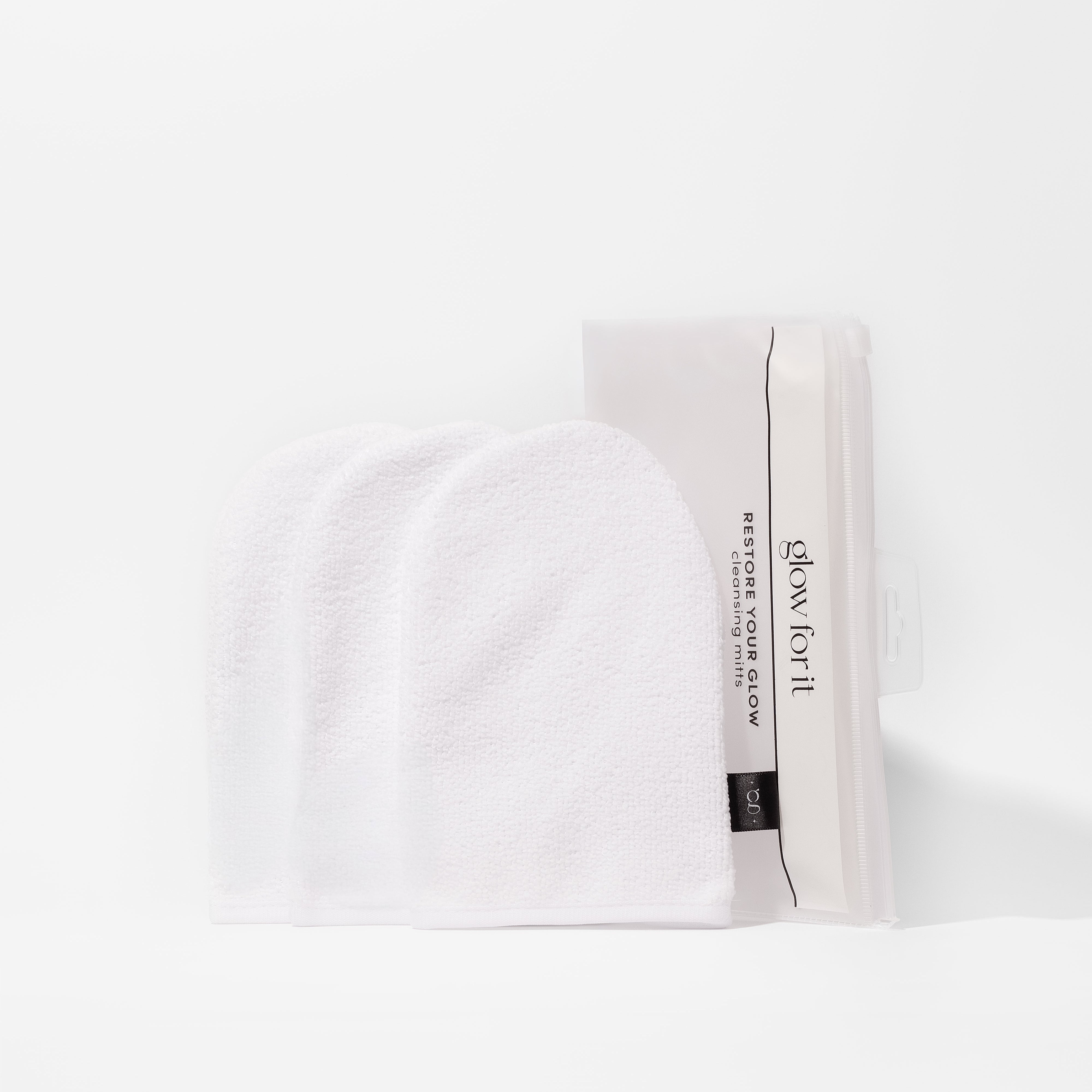 White cleansing mitts with 'glow for it' branding on a white background
